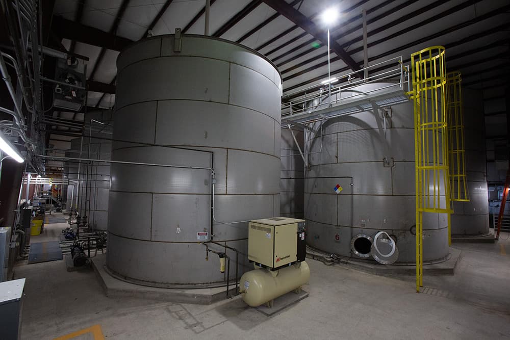 Two bulk tank storage tanks with ladder